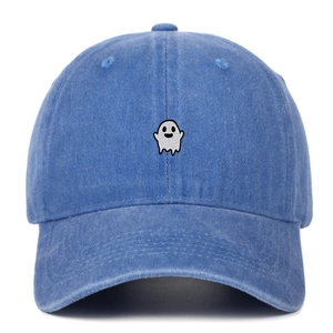 Close-up of ghost embroidery on washed denim blue cotton baseball cap with curved brim