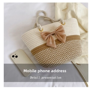 Macro detail of hand-woven tote bag with cotton ropes and a satin ribbon bow detail