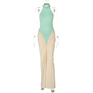 Detail of mint green halter neck and beige pleated patchwork maxi bodycon dress