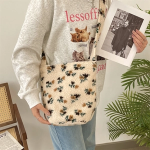 Floral plush shoulder bag shown on model for a trendy autumn winter daily outfit