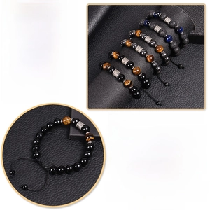 Close-up of men's natural tiger eye and lava stone beaded bracelets with metal spacers