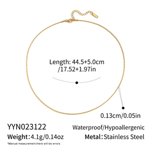 Detail of minimalist gold-plated stainless steel chain with lobster clasp and extension