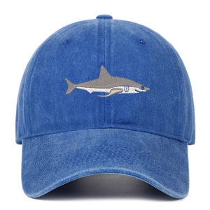 Close-up of a royal blue cotton baseball cap featuring detailed shark embroidery