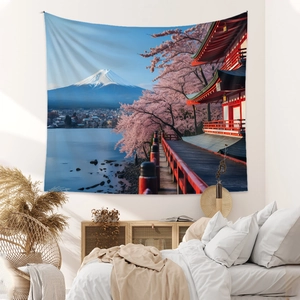 Detail view of Bohemian Mount Fuji tapestry with cherry blossoms on a bedroom wall