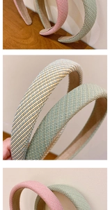 Detail showing the woven texture and sponge padding of striped pastoral style headbands