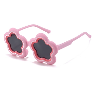 Pink flower-shaped kids cartoon sunglasses with dark lenses for sun protection