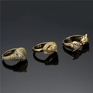 Detailed macro view of 18K gold-plated leopard head rings with zircon micro-pave