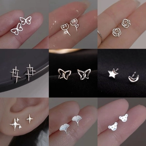 Elegant 925 sterling silver earring set with butterfly, star, and flower designs
