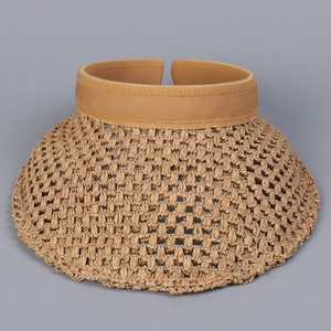Detail of hand-woven straw visor hat with hollow top and letter R logo for summer