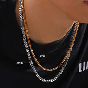 Mens stainless steel Cuban link necklaces in 3mm gold and 4mm silver finishes on model