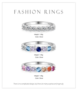 Detalle de anillos de plata S925 con circonitas transparentes y de colores variados