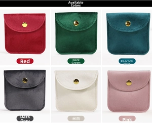 Detail view of velvet jewelry pouches with gold snap buttons in six elegant colors