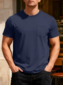 Detailed view of men's navy waffle knit t-shirt featuring a front pocket and textured fabric