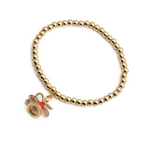 Bracelet à billes dorées avec pendentif cloche en émail rouge et zircons colorés
