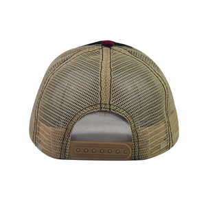 Detail view of the breathable mesh back and adjustable snapback closure on a trucker hat
