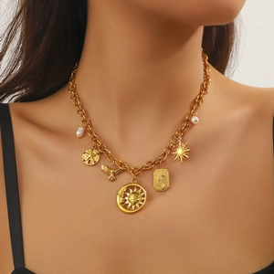 Vintage gold-plated stainless steel necklace featuring celestial charms and pearl accents