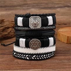 Macro shot of men's leather multi-layer bracelet with skull and hexagram metal charms