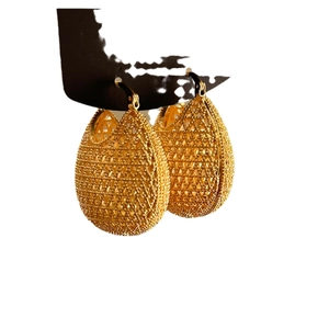 Golden hollow woven teardrop earrings in vintage metallic style for elegant women