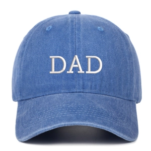 Close-up of DAD embroidery on blue washed cotton denim baseball cap with curved brim