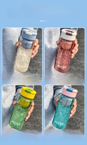 Detailed view of 650ML portable sports water bottles in four colors with tea filters