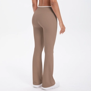Detail view of high waist yoga flare pants featuring white contrast trim and taupe fabric