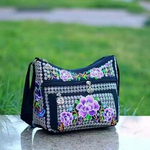 Ethnic style canvas crossbody bag with floral embroidery and multi-zipper pockets