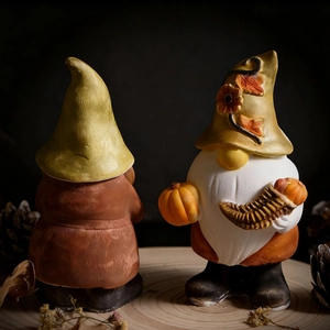 Detail showing the front and back of a harvest gnome holding a pumpkin for DIY molding