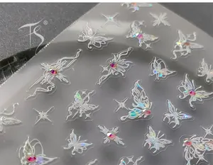 Macro detail of 5D butterfly nail stickers with colorful aurora rhinestones and laser finish