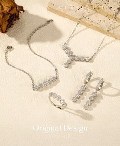 Elegant S925 sterling silver jewelry set featuring floral necklace, earrings and ring on stone