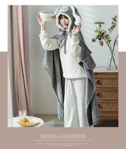 Close-up of grey bunny ear hooded cloak made of soft fleece with cozy waist strap tie