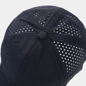 Top-down view of laser-cut ventilation holes and stitching on quick-dry baseball cap