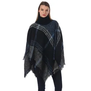 Women's turtleneck poncho sweater in blue plaid pattern with elegant fringe hem