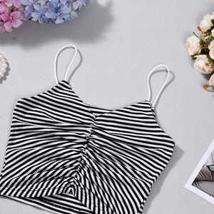 Close-up of black and white striped crop top with ribbed texture and drawstring detail