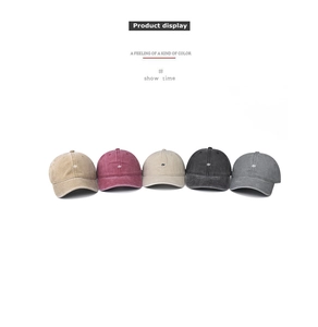 Detail of five vintage washed cotton baseball caps with small embroidered B logos