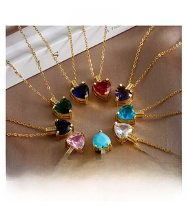 Detail showing heart-shaped gemstone necklaces in ten colors with gold-plated micro-pave zircon