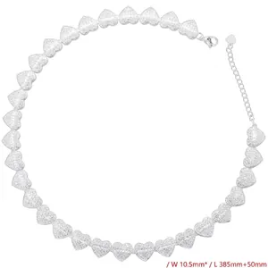 Detail view of heart-shaped links with pave-set zircon and adjustable lobster clasp