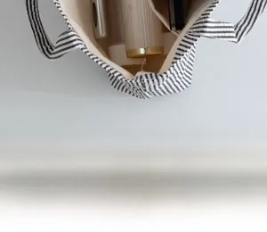 Top view of striped canvas tote bag interior showing large capacity and beige lining