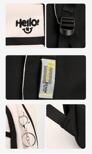 Detail of embroidered canvas backpack showing stitching, straps and zip hardware