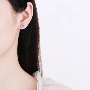 Classic oval moissanite stud earrings in S925 sterling silver worn by a model