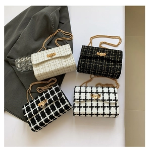 Detail of tweed flap bags with gold chain straps in four different plaid patterns