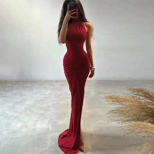 Close-up of ruched detail and slim fit red halter dress with elegant back zipper