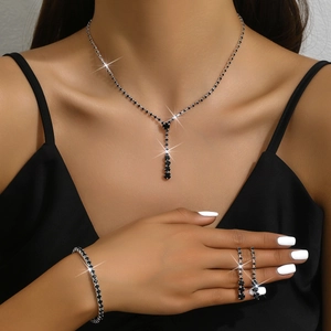 Elegant silver-tone jewelry set with black zircon necklace, bracelet and stud earrings