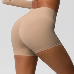 Detail of high waisted seamless yoga shorts with peach lift design in beige color