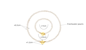 Detailed view of baroque freshwater pearl necklace and bracelet set with OT flower clasp