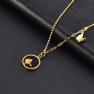 Golden butterfly necklace with black enamel pendant and mixed-link chain on black leather
