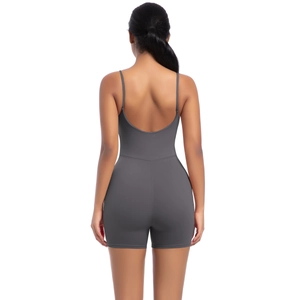 Detail of cross-back straps and open-back design on dark grey yoga bodysuit for women