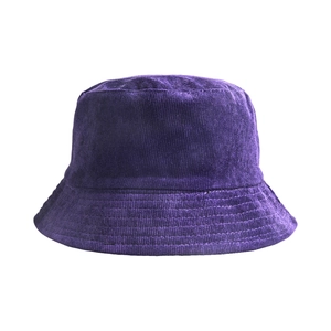 Detailed close-up of dark purple corduroy fabric texture and stitching on the bucket hat