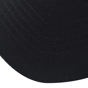 Detailed macro view of parallel stitching and textured fabric on the black cotton baseball cap