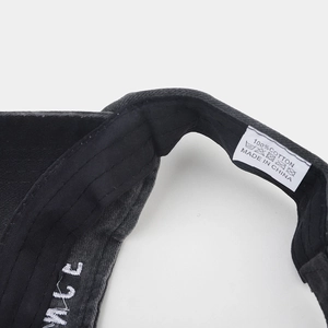 Detail of the 100% cotton inner sweatband and embroidered logo on this washed sun visor