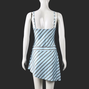Detail of blue and white striped backless mini dress with asymmetric hem on mannequin